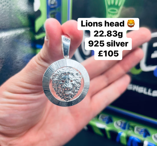 Silver lions head pendant